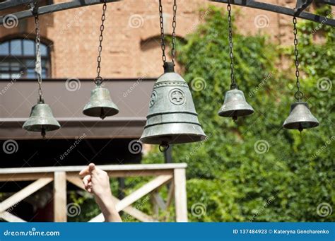 The Art of Ringing a Set of Tuned Bells. Church Bells Hanging Outdoor. Bells Ringing on Wind ...