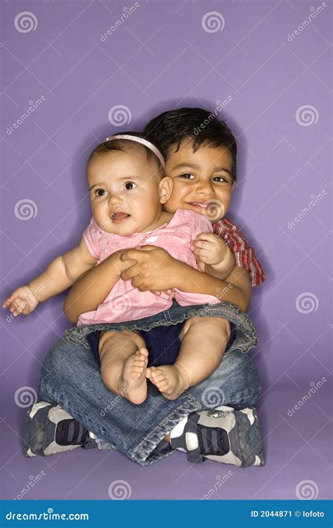 Boy Holding Baby Girl. Stock Image - Image: 2044871