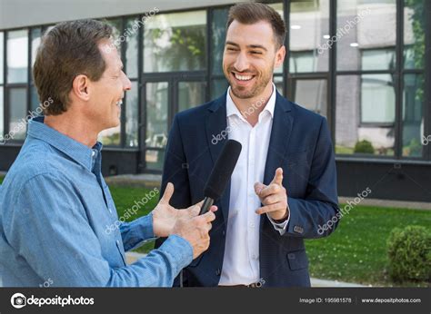 Professional Mature Journalist Interviewing Public Cheerful Businessman ...