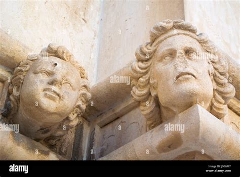 Sculpted heads, on side of Sveti Jakov, cathedral of Saint James, old town, Sibenik, Dalmatia ...