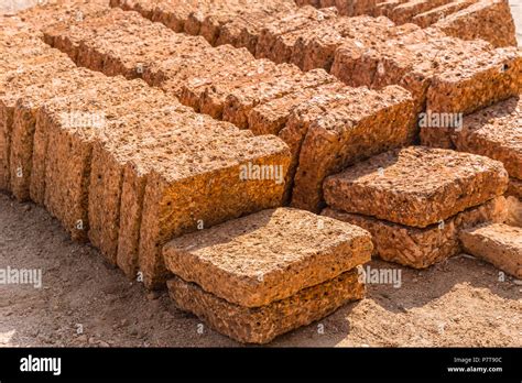 Laterite rock stone bricks plate from nature reddish rusty red color from rich in iron oxide ...