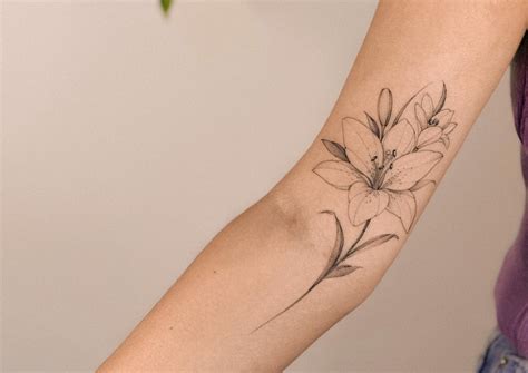 AMAZING LILY TATTOO DESIGNS + A DEEP DIVE INTO THEIR MEANINGS IN 2024