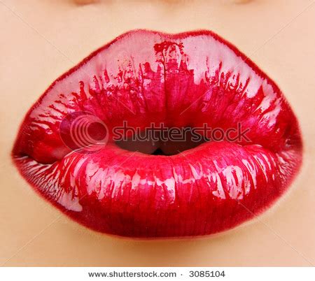 Picture of a Woman's Lips with Red Lipstick, Puckered up and Ready for Kissing in This Stock Photo