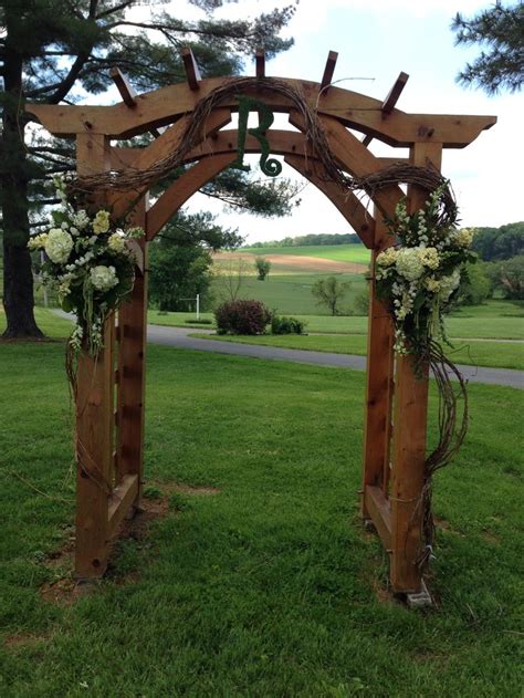 Country wedding trellis decorated with grapevine and garden flowers Floral Impressions, Hunt ...