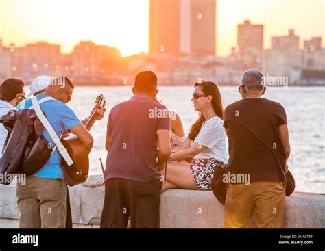 Musicians serenade tourists on the Malecon boardwalk in Havana, Cuba; Havana, Havana, Cuba Stock ...