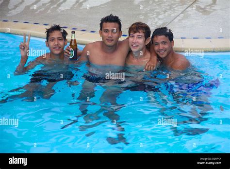 4 Thai guys having fun in a swimming pool, Phuket Thailand Stock Photo ...