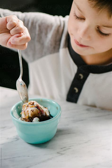 "Boy Eating Ice Cream Sundae" by Stocksy Contributor "CWP, LLC" - Stocksy