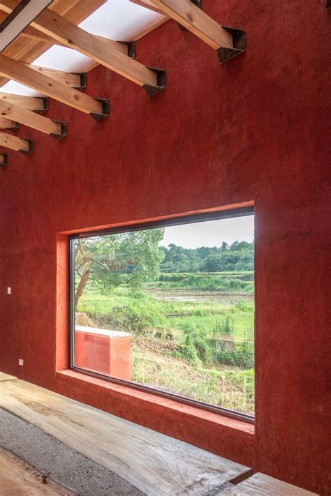 Red concrete walls enclose The Walls teaching restaurant in China China ...