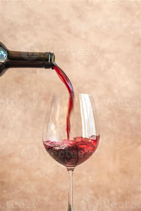 Red wine pouring into glass 6163382 Stock Photo at Vecteezy