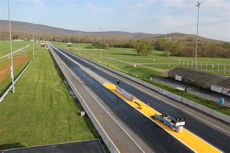 an aerial view of a highway with cars driving on the road and green ...