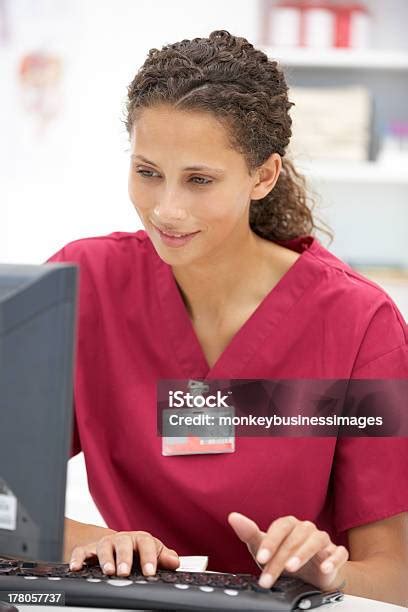 Young Hospital Doctor At Desk Stock Photo - Download Image Now - Administrator, Healthcare And ...