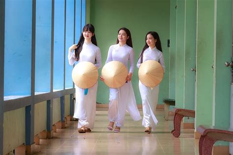 photo, three, women, wearing, white, long-sleeved, dresses, vietnam ...