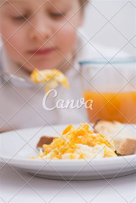 Boy Eating Scrambled Eggs - Photos by Canva