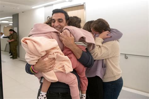 Israeli husband, dad hugs wife and young daughters in tearful reunion