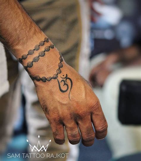 20+ Spiritual Om Tattoo Designs Ideas for Both Men and Women | Om tattoo design, Wrist tattoos ...