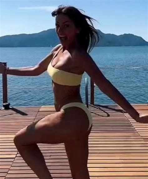 Davina McCall, 54, leaves fans stunned as she flaunts age-defying figure in yellow bikini ...