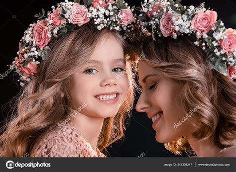 Mother and daughter in wreaths — Stock Photo © ArturVerkhovetskiy ...