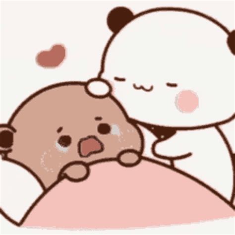 a drawing of a bear hugging a teddy bear on top of a pillow with hearts around it