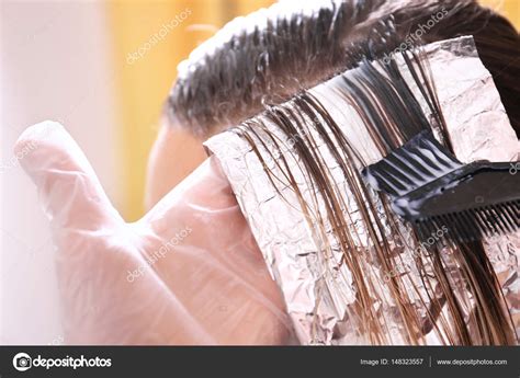 Process of dyeing hair — Stock Photo © belchonock #148323557