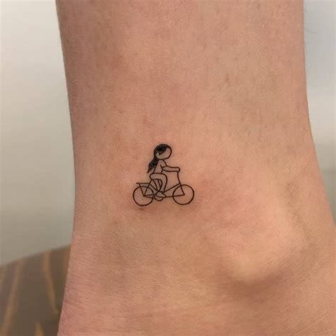 Minimalist cyclist tattoo on the ankle.