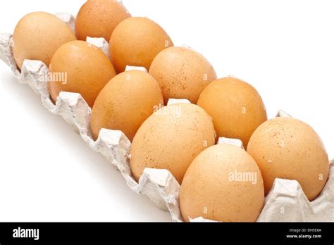 Brown eggs in a carton package on white background Stock Photo - Alamy