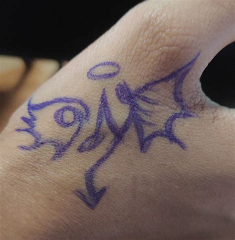 a person's hand with purple ink on it and an arrow drawn in the middle