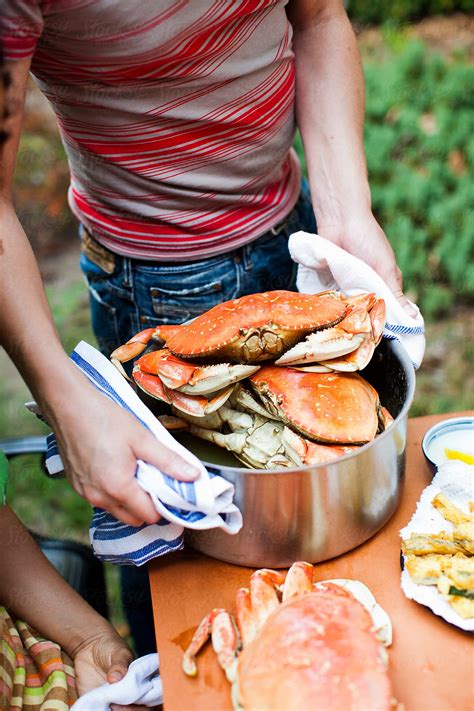 "Crab Cracking Dinner Party" by Stocksy Contributor "Sara Remington ...