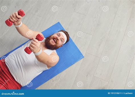 Funny Fat Man Doing Exercises with Dumbbells on a Workout on the Floor in the House. Stock Image ...