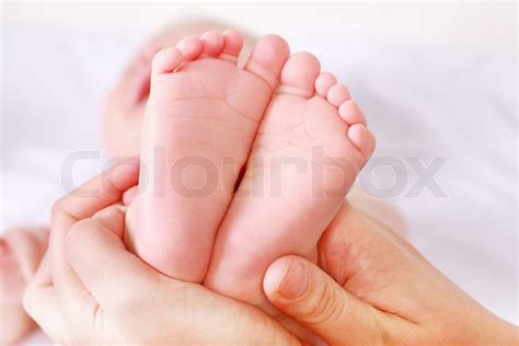 Detail of newborn's feet and hand - shallow DOF | Stock image | Colourbox