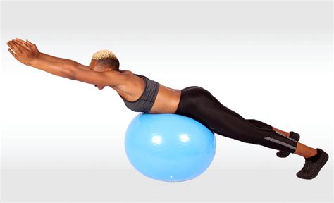 Fit Woman Doing Back Extensions Exercise on Swiss Ball
