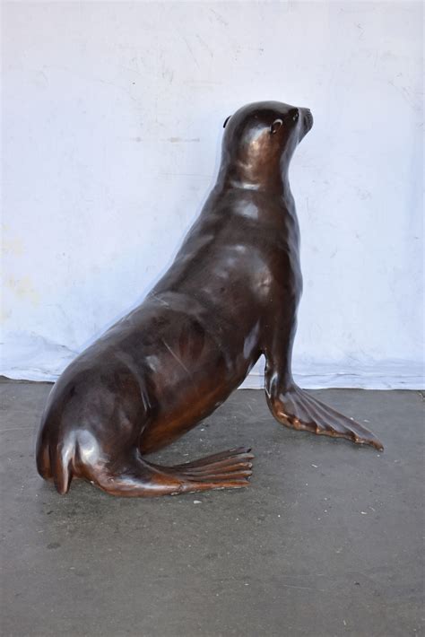 Perched Life Size Seal bronze statue - Size: 40"L x 35"W x 31"H. - NiFAO