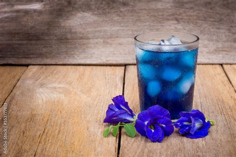 Butterfly pea or blue pea (clitoria ternatea) flowers and glass of blue ...