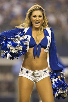 A Dallas Cowboy cheerleader performs during a game against the New York ...