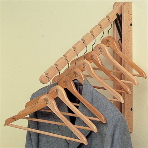 Wooden fold-away hanging rail | Coat hanger, Wall mounted coat hanger ...