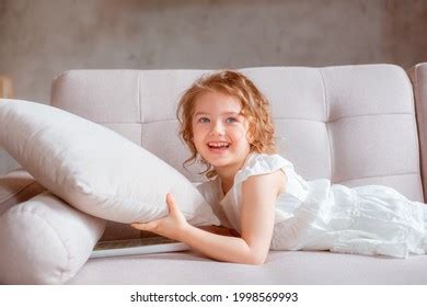 Little Girl Lying On Couch Stock Photo 1998569993 | Shutterstock