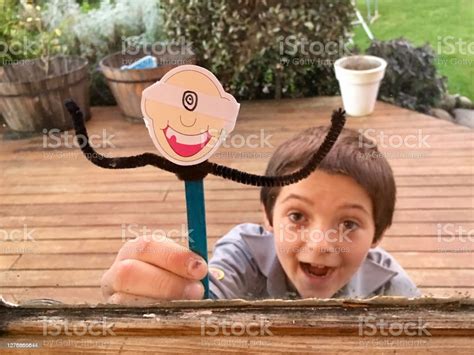 Child Holds His Stick Man Puppet Stock Photo - Download Image Now - 6-7 Years, 8-9 Years ...
