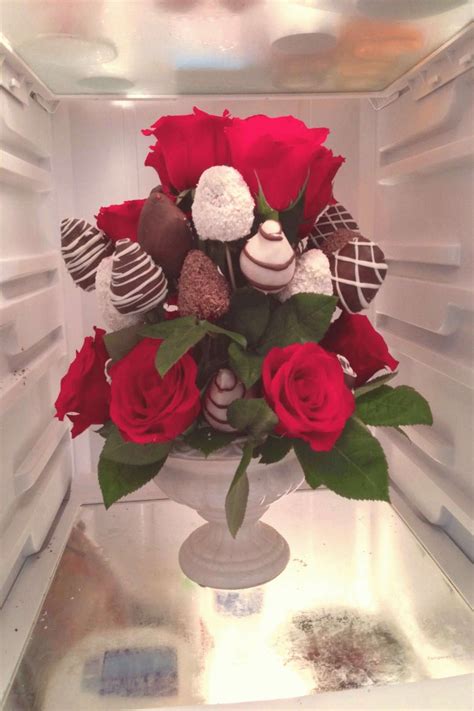 Edible arrangement with red toes and chocolate covered strawberries ...