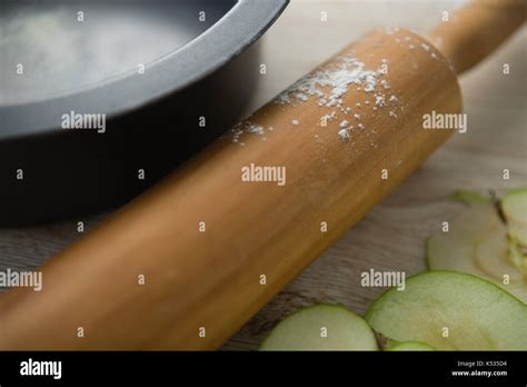Close up of rolling pin by container on table Stock Photo - Alamy