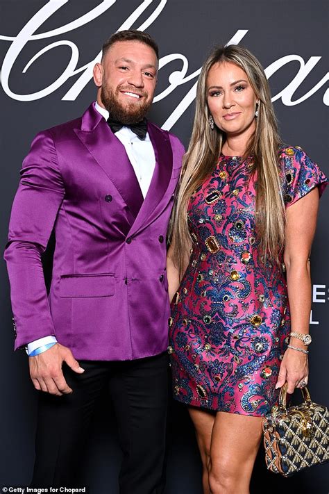 Conor McGregor and fiancee Dee Devlin pack on the PDA in series of
