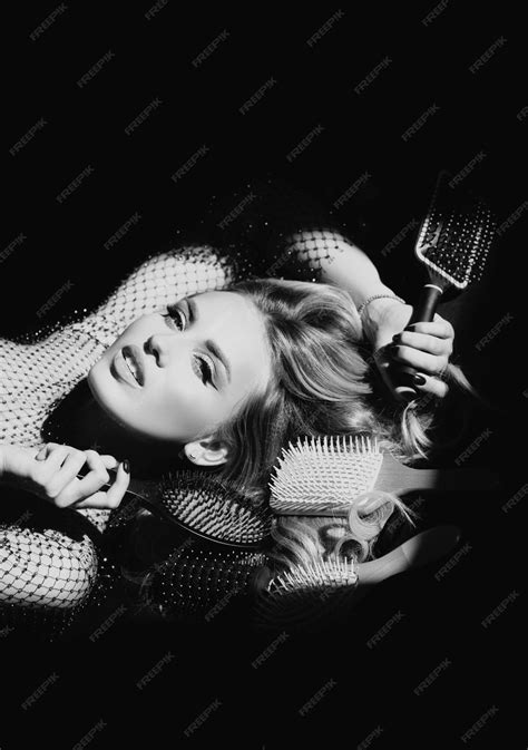 Premium Photo | Sexy woman with a comb and brushing hair sensual girl