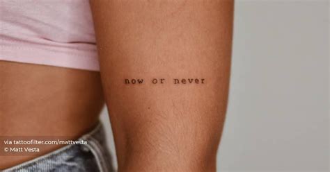 Tattoo that says "now or never" located on the upper