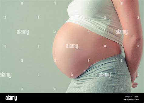 Pregnant woman maternity picture of her belly Stock Photo - Alamy