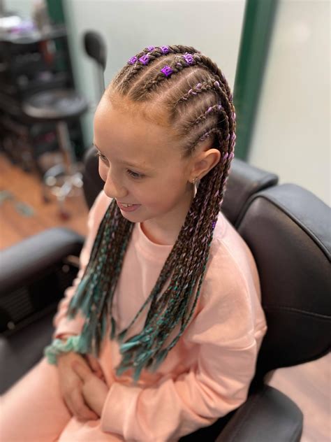 Med sized half cornrows/half box braids | braidland.com