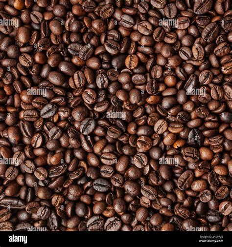 Roasted coffee beans background Stock Photo - Alamy