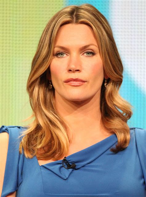 Download Natasha Henstridge Smiling Radiantly Wallpaper | Wallpapers.com