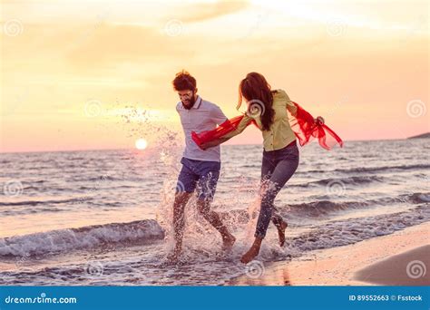 Romantic Couple In Hug Watching Sunrise/ Sunset Together.Young Man And ...