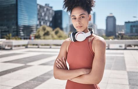 Premium Photo | Music fitness and black woman in a city portrait for ...