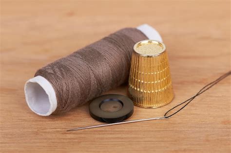 premium photo thimble  needle