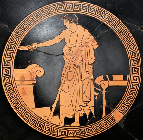 an ancient greek vase with a woman washing her hands