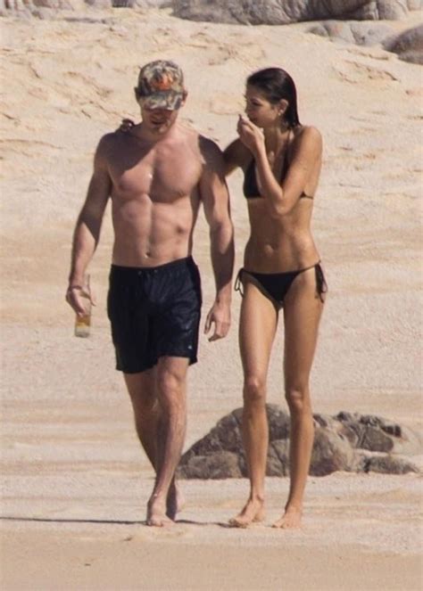 Kaia Gerber stuns in tiny black bikini on getaway with her fit boyfriend
